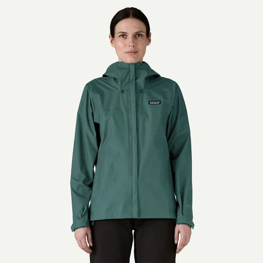Person wearing a green rain jacket with a visible brand logo on a white background