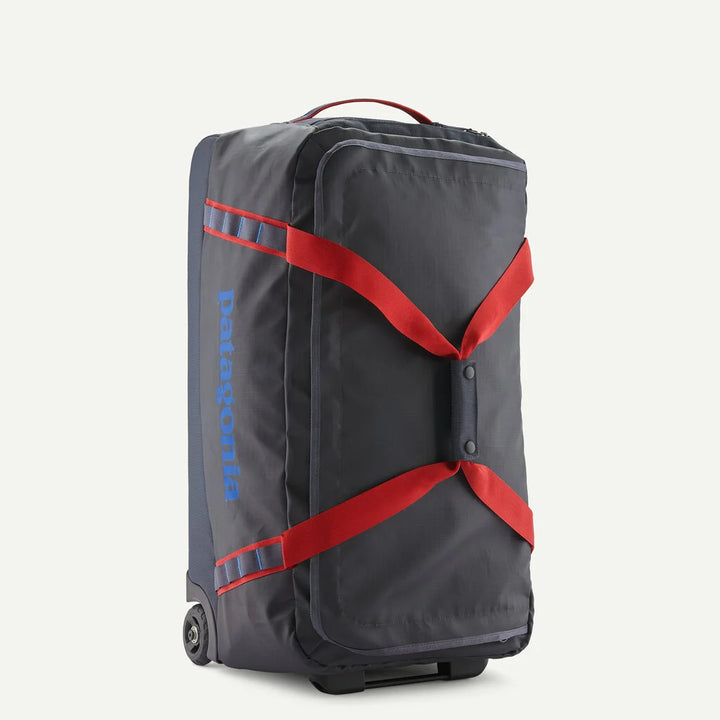 Patagonia : Black Hole® Wheeled Duffel 70L in Smolder Blue / red