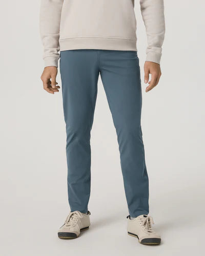 Person wearing Vuori - Meta Pant - 30" and a beige sweater on a white background