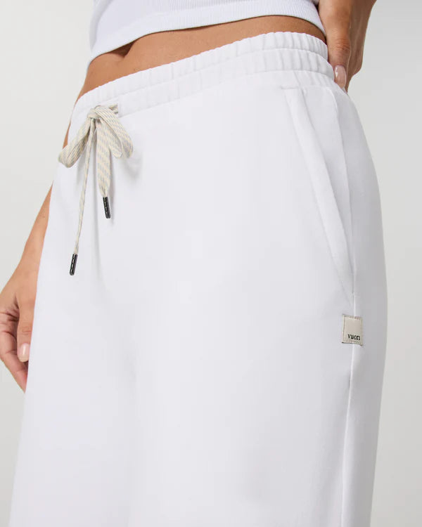Vuori - Halo Essential Widelegs with drawstring and brand logo on a plain background