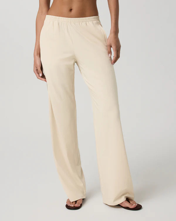 Person wearing Vuori - Villa Everyday Wideleg pants on a plain background