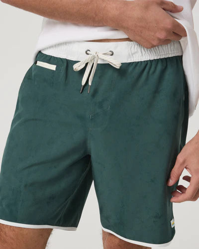 Vuori Banks Short with a white drawstring and trim on a neutral background